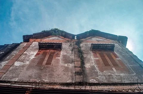 A worm eye view of an aged, dilapidated colonial era building in Indonesia .. Stock Photos