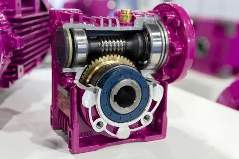 Worm reduction gear in section on stand is close-up. Industry Stock Photos