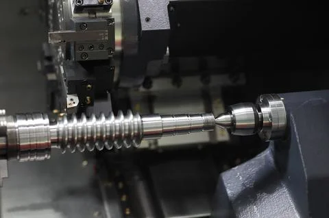 Worm shaft cutting process on CNC lathe machine Stock Photos