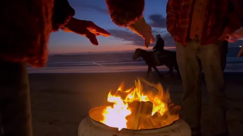 Worming hands by fire Stock Footage 305941342