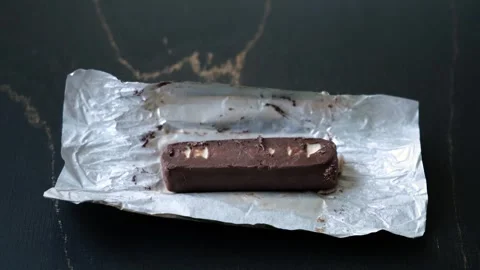 Worms crawls on chocolate candy. Crawling larvae and eggs laid on food. Not Stock Footage 290850646