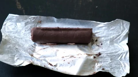 Worms crawls on chocolate candy. Crawling larvae and eggs laid on food. Stock Footage 292083856