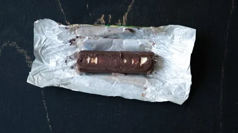 Worms crawls on chocolate candy. Crawling larvae and eggs laid on food. Stock Footage 295107340