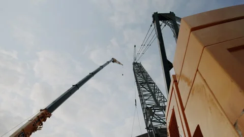 Worm's Eye View Reveal Of Construction Site Cranes 4K 48FPS SLO-MO Stock Footage 265701467