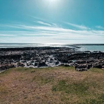 Worm's Head is a tidal island located on the Gower Peninsula in South Wales.. Stock Photos