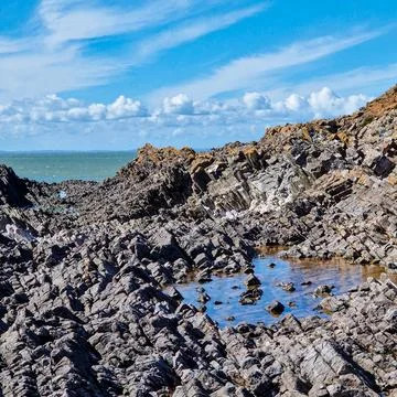 Worm's Head is a tidal island located on the Gower Peninsula in South Wales.. Stock Photos