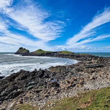 Worm's Head is a tidal island located on the Gower Peninsula in South Wales.. Stock Photos
