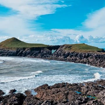 Worm's Head is a tidal island located on the Gower Peninsula in South Wales.. Stock Photos