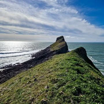 Worm's Head is a tidal island located on the Gower Peninsula in South Wales.. Stock Photos