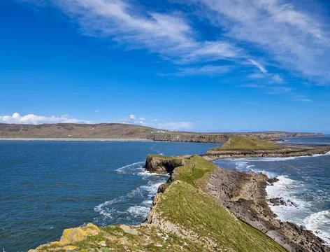 Worm's Head is a tidal island located on the Gower Peninsula in South Wales.. Stock Photos
