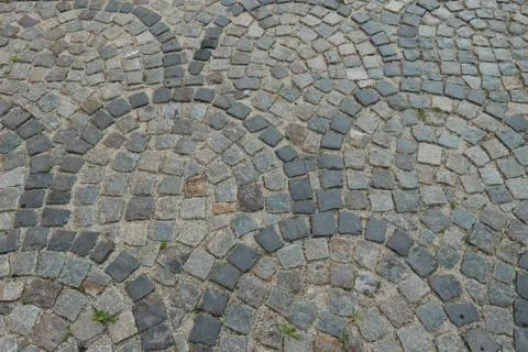 Worn cobblestone pavement walkway pattern Stock Photos