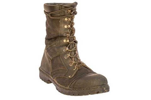 Worn Combat Boot on White Background Stock-Fotos