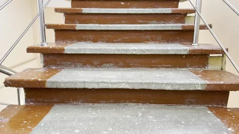 Worn concrete steps with brown-painted edges Stock Footage 331332023
