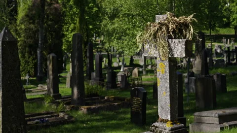 Worn down gravestone with moss on top of it at an old cemetery. Variation 2 Stock Footage 274987046