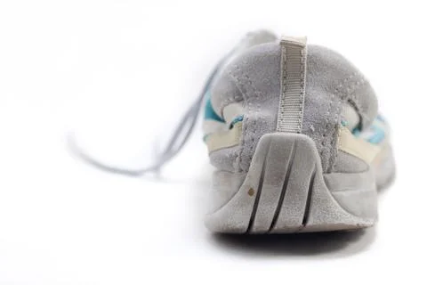 Worn down heels on sneakers Stock Photos