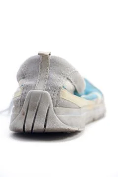 Worn down heels on sneakers Stock Photos