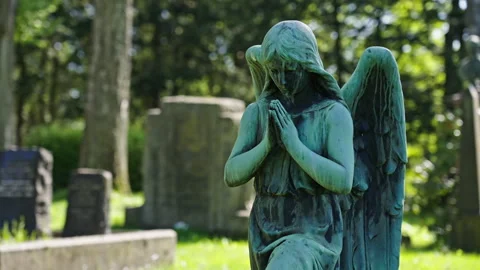 Worn down statue of a kneeling angel on a old cemetery. Variation 1 Stock Footage 274987237