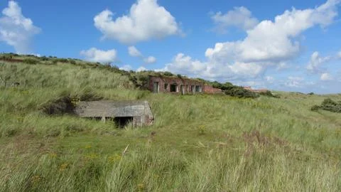 Worn down war bunkers in the dunes Stock Photos
