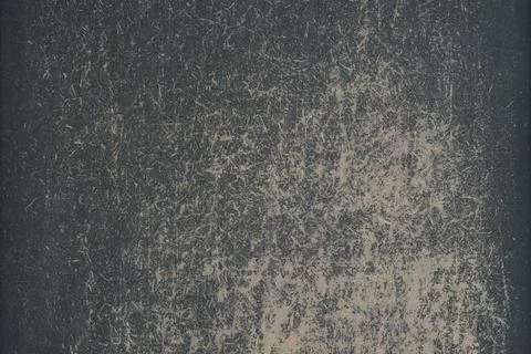 A worn drawing board with a rough surface with remnants of black paint. Backg Stock Photos