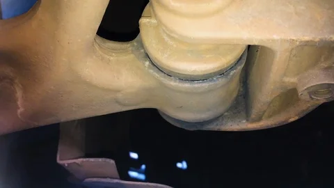 Worn front lower contol arm bush on a motor vehicle Stock Footage 113507346