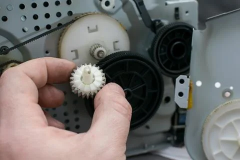 Worn gear in the hands of the master Stock Photos