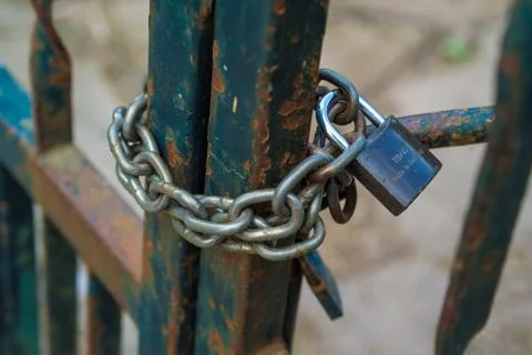 Worn Lock with long chain Stock Photos