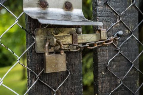 Worn Lock with small chain Stock Photos