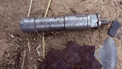 Worn Machined Metal Component Lying On Dry Sandy Ground Close Up Stock Photos