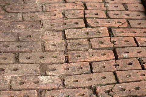 Worn old red brick ground as background Stock Photos