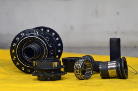 Worn-out bicycle bushing with spokes Stock Photos
