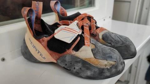 Worn out climbing shoes Stock Footage 285733539