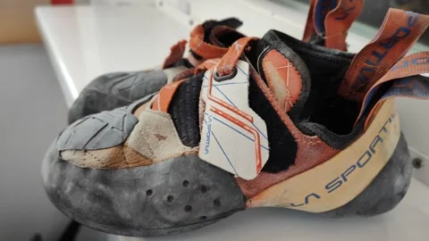 Worn out climbing shoes from side Video stock 285733546