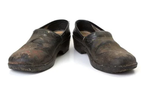 Worn out clogs Stock Photos