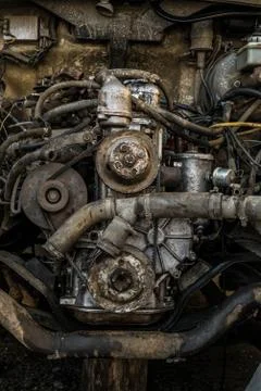 Worn out engine of an old car. Front view close-up. Stock Photos