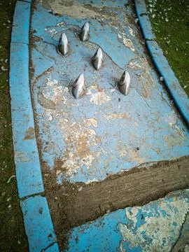Worn Out Miniature Golf Course Obstacle with Metal Pins Foto stock