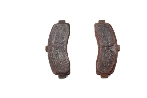 Worn pads of disk brakes. Stock Photos