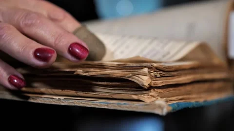 Worn pages of an ancient book Stock Footage 222966076