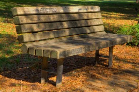 Worn park bench hdr Stock Photos
