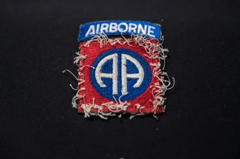 Worn patch of the 82nd Airborne Division on a black background Stock Photos