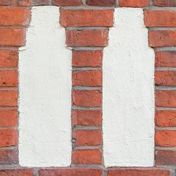 Worn Plaster Columns in Red Brick Wall Stock-Fotos