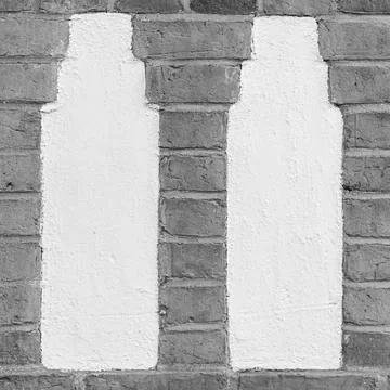 Worn Plaster Columns in Red Brick Wall Foto stock