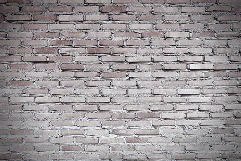 Worn red brown brick wall. The facade of an industrial building. Monochrome i Stock Photos