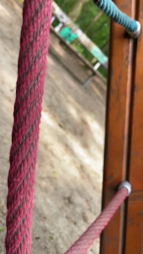 Worn ropes entangled with aged hardware beneath wooden construction framework 스톡 동영상 335354899