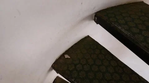 Worn spiral staircase with patterned steps. Video stock 342387428
