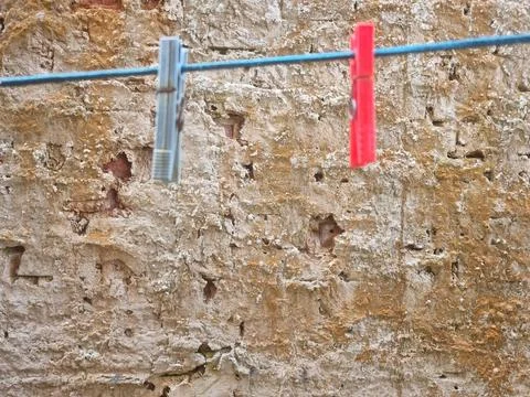 Worn wall with clothespins Stock Photos