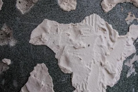 Worn white peeling plaster. Stock Photos