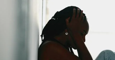 Worried African woman feeling anxiety. Silhouette black woman in depression Stock Photos