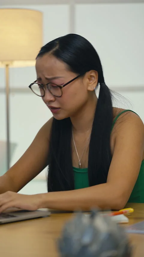 Worried Asian student facing program error on laptop, corrupted file problem Stock Footage 313720910