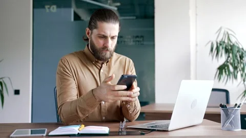 Worried businessman having problems with software or service on smartphone mobil Stock Footage 316142108