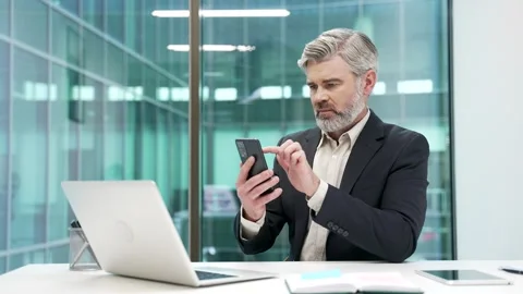 Worried businessman having problems with software or service on smartphone mobil Stock Footage 317754797
